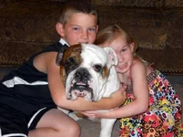 Kids hugging Rex Resized.webp